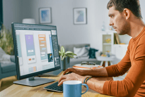 man typing on computer
